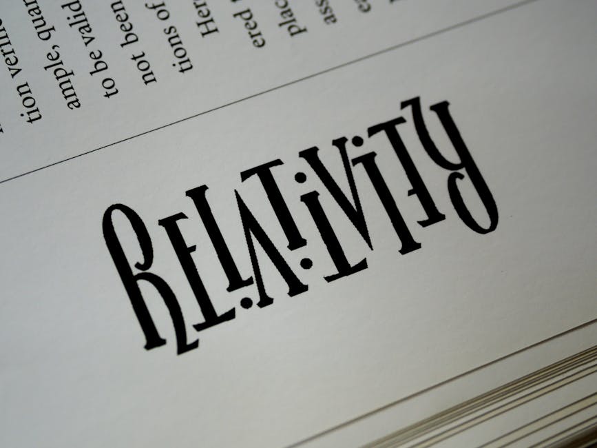 Close-up of artistic typography with the word 'Relativity' printed on paper.